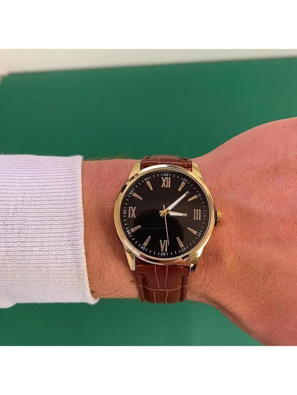 Minimalistic Black essential vintage style gold and leather style band watch. 9